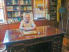 27_Ted_Hartman_seated_at_General_Patton's_Desk